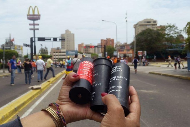 A member of the Popular Will opposition party shows tear gas canisters shot by Venezuelan security forces in the Zulia state. The Venezuelan opposition is holding protests nationwide against President Nicolas Maduro's socialist regime. Photo courtesy of Popular Will Zulia