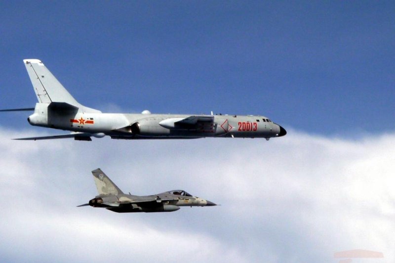 Taiwan’s defense ministry released photos on Friday of Taiwan’s multiple combat aircraft (bottom) closely monitoring Chinese warplanes. File Photo courtesy of Taiwan Defense Ministry