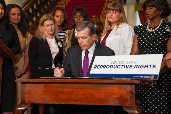 North Carolina Gov. Roy Cooper signed an executive order Wednesday protecting access to abortion in the state. Photo courtesy of North Carolina Gov. Roy Cooper/<a href="https://www.facebook.com/roycoopernc/posts/597888675036736?__cft__[0]=AZU2Vet5gtySJLsb8aOYopnb4SR30DYp0ZZxYYrLuFHdrSFSlgwl6fLoXzYmhq7-kuTBugrRtXzFQDknheYkyfJc-f6lBgkw81GbOlY_gAV9hOhj_i7C1N_sUUiTQQcVHE_Ai8LrexmEBJ3kHc8oi-50D_rgnSoikCESuzp9PWUP-E7FHFbIHT13m3r3hBJ_OqIB3uKpKmvWFg7CYbCGCK_7&amp;__tn__=%2CO%2CP-R">Facebook</a>