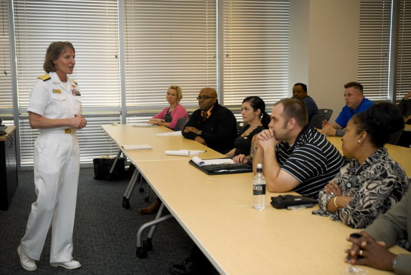 Rear Adm. Robin Graf, deputy commander of Navy Recruiting Command, discusses the U.S. Navy maritime strategy with military division employees at the University of Phoenix. Photo courtesy of the U.S. Navy via Wikimedia Commons.