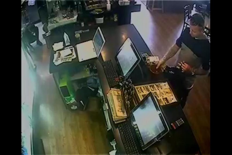 A customer at a New Zealand restaurant steals a tip jar, but ends up with less than he'd spent on carryout food, which he left behind. Nando's Riccarton/Facebook video screenshot