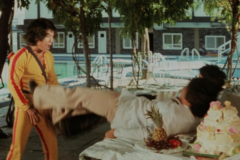 Dragon Lee wears a yellow track suit like Bruce Lee's iconic one. Photo courtesy of Severin Films