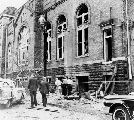 Police investigators inspect bombing damage on the eastern facade of 16th Street Baptist Church in Birmingham, Ala., on September 15, 1963. Photo courtesy Birmingham Public Library