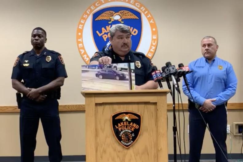Lakeland Police Chief Sam Taylor holds up an image captured from video of the sedan used Monday afternoon in a drive-by shooting in the city. Screen capture courtesy of Lakeland Police Department/Facebook