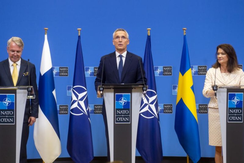 NATO Secretary-General Jens Stoltenberg (C) attends a news conference with Minister of Foreign Affairs of Finland Pekka Haavisto and the Minister of Foreign Affairs of Sweden Ann Linde following the signature of the NATO accession protocols for Finland and Sweden. Photo courtesy of NATO