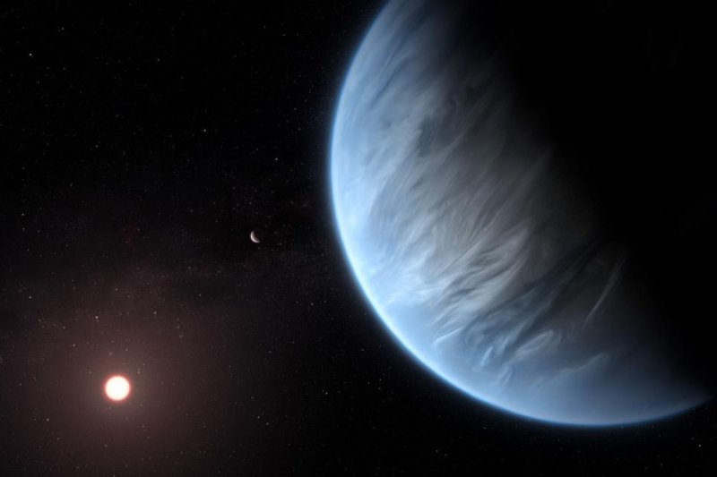 An illustration showcases a watery world orbiting within its host star's habitable zone. Photo by UCL<br>