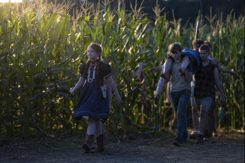 Eden (Kate Moyer, L) leads the "Children of the Corn." Photo courtesy of RLJE Films