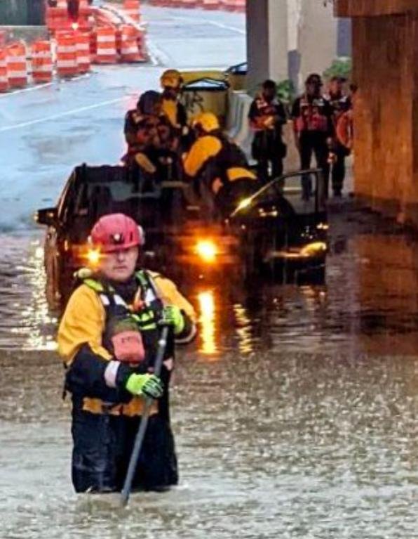 Firefighters and other emergency personnel participate in a water rescue on Rhode Island Avenue Northeast in Washington, D.C., on Wednesday afternoon. Photo courtesy DC Fire and EMS/Twitter