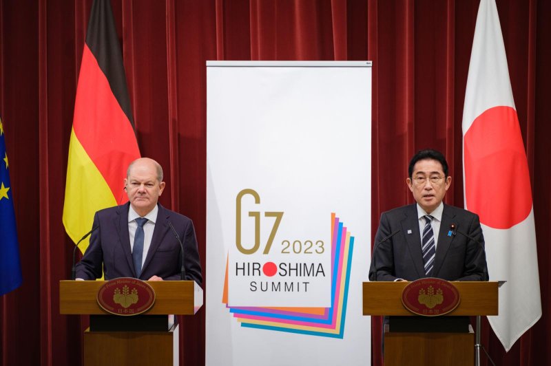 German Chancellor Olaf Scholz (L) and Japan's Prime Minister Fumio Kishida (R) attend a press conference after the Germany-Japan Summit in Tokyo on Saturday. Photo by Nicolas Datiche/EPA-EFE