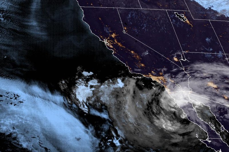 Tropical Storm Kay, lower right, is seen off the coast of Baja California early on Friday. It is expected to remain a tropical storm on Friday before weakening to a depression early Saturday. Image courtesy NOAA/NHC