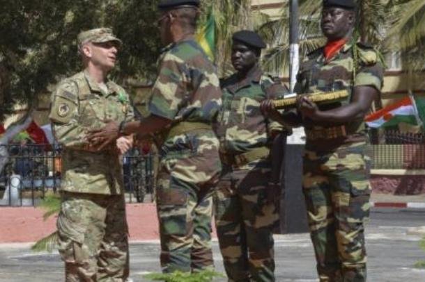U.S. Army Brig. Gen. Donald C. Bolduc, Special Operations Command-Africa commander, shakes hands with Senegal army Major Gen. Mamadou Sow, chief of general staff, after being inducted into the Senegal National Order of the Lion, the highest category of Senegal’s military awards. Bolduc said there are increasing concerns Islamic State militants and the Boko Haram are coordinating efforts in the Lake Chad region. Photo by Staff Sgt. Christopher Klutts/U.S. Africa Command