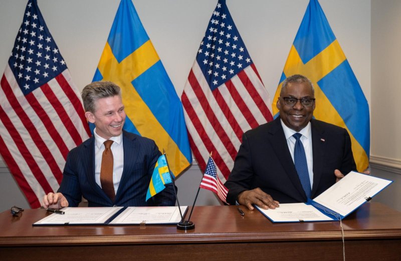 U.S. Secretary of Defense Lloyd Austin (L) and Swedish Defense Minister Pål Jonson sign the Defense Cooperation Agreement on Tuesday at the Pentagon, deepening their two countries' military ties. Photo courtesy of U.S. Secretary of Defense Lloyd Austin/X