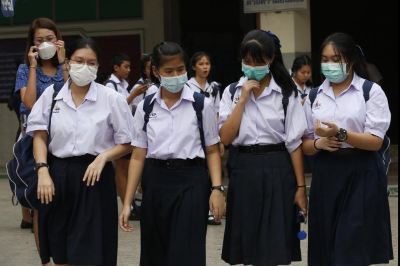 Thai students wear face masks Wednesday amid heavy air pollution in Bangkok, Thailand. Photo by Narong Sangnak/EPA-EFE