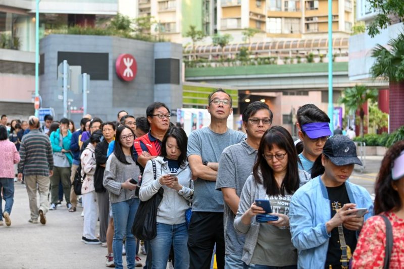 Voters began lining up early in the morning for the 7:30 a.m. poll opening in Hong Kong's District Elections on Sunday. Photo by Thomas Maresca/UPI