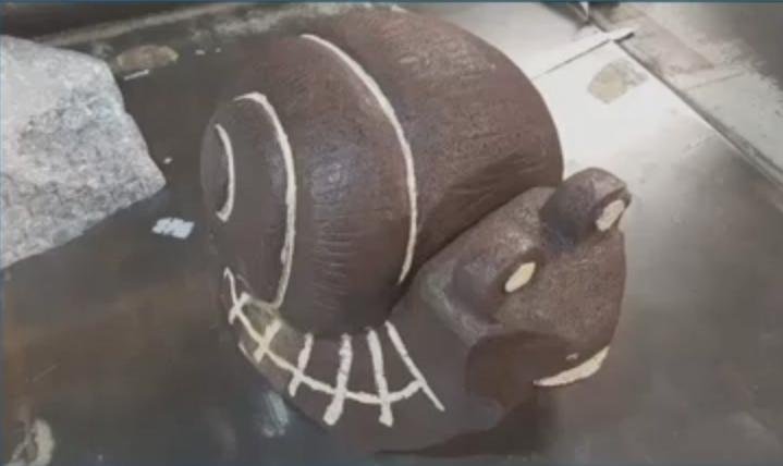 A snail statue filled with more than 50 pounds of methamphetamine was seized by Customs and Border Protection officers in Cincinnati. Officials detected anomalies inside the statue during an X-ray inspection and drilled a hole in the statue to reveal the drugs. Screen capture/WXIX