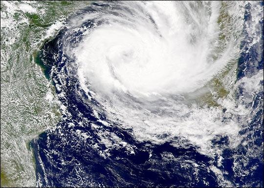 A satellite photo shows Tropical Storm Dineo approaching Africa's eastern coast. Seven people died, and 20,000 homes were destroyed in Mozambique after the storm arrived Thursday. South Africa is preparing for rain and high winds expected during the weekend. Image courtesy of NASA