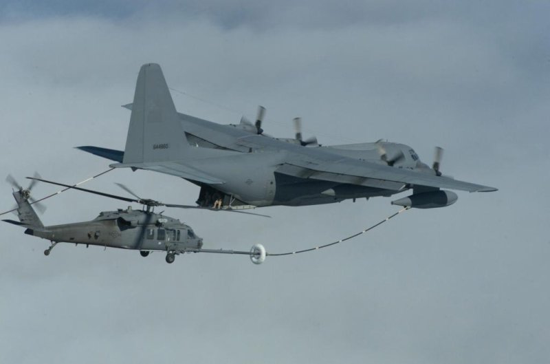 A U.S. Air Force MC-130P refuels an HH-60 Paveway helicopter. U.S. Air Force photo by Staff Sgt. Lanie McNeal