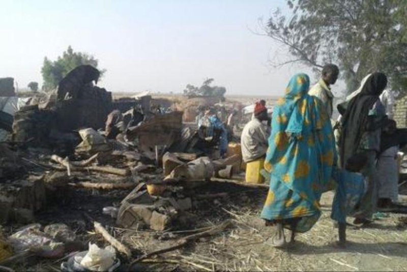 Refugees survey the damage from an airstrike at an encampment in Rann, Nigeria, on Tuesday in which 52 people were killed and 120 wounded, according to aid organization Doctors Without Borders. Photo courtesy Médecins Sans Frontières