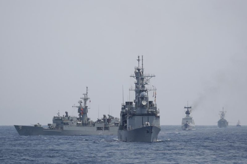 Taiwan naval battleships maneuver in Hualien, Taiwan, on Wednesday. Photo by Ritchie B. Tongo/EPA-EFE