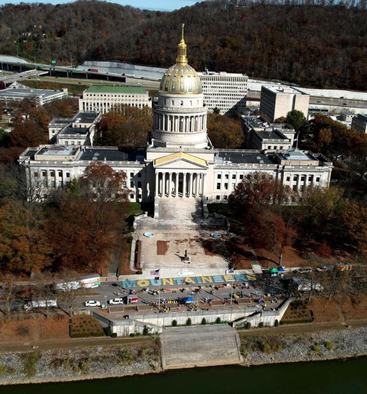 The Mountain Mission food bank in Charleston, W.Va., used 25,550 cans of food to spell out the word "Mountaineers" in front of the state Capitol Building and broke a Guinness World Record. <a href="https://www.facebook.com/photo/?fbid=689122275904007&amp;set=pcb.689122409237327">Photo courtesy of Gov. Jim Justice/Facebook</a>
