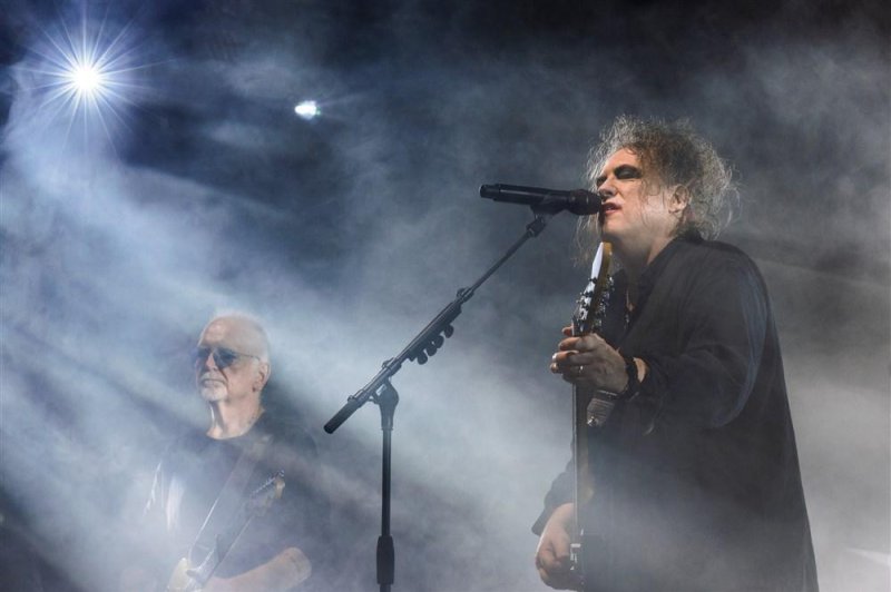 Reeves Gabrels (L) and Robert Smith of The Cure perform in Budapest, Hungary in 2022. Though the band wanted to keep concert prices low, they are frustrated by Ticketmaster fees. EPA-EFE/Balazs Mohai