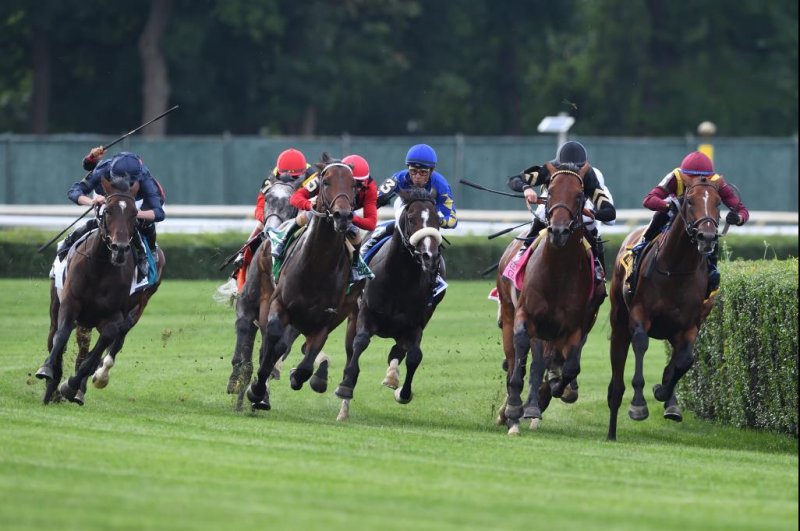 Bolshoi Ballet (far left, dark blue), shown winning the 2021 Belmont Derby in New York, returns to action on the Lingfield Park all-weather surface Saturday in England. Photo by Dom Napolitano, courtesy of New York Racing Association