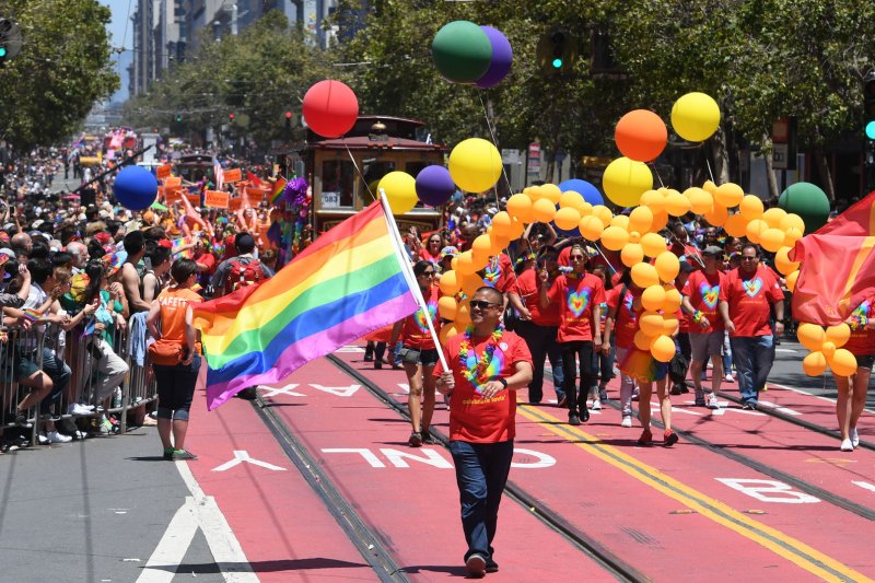 Celebrants march up Market Street in the annual gay pride parade in San Francisco on June 26. The United Nations on Thursday voted to create a watchdog position to investigate and report on discrimination and violence agisnt gays, lesbians, bisexuals and transgender individuals for the first time. Photo by Terry Schmitt/UPI
