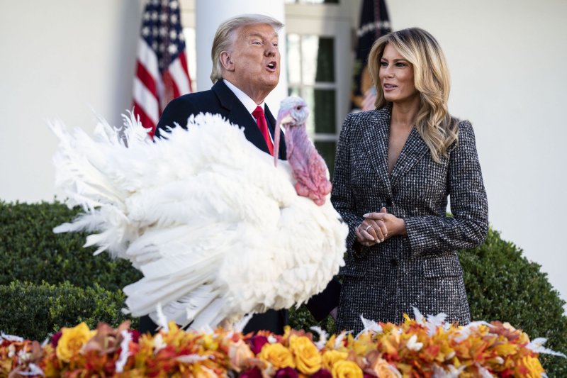 President Donald Trump, joined by first lady Melania Trump, pardons Corn, the national Thanksgiving turkey, during a ceremony in the Rose Garden at the White House on Tuesday. Photo by Kevin Dietsch/UPI | <a href="/News_Photos/lp/0f8583d57dd1216342dfe468f92b2cc0/" target="_blank">License Photo</a>