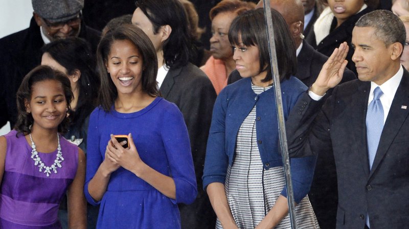 Sasha Obama, Malia Obama, First Lady Michelle Obama and U.S. President Barack Obama arrive at the reviewing stand at the Inaugural Parade after his public inauguration ceremony in Washington, D.C. on January 21, 2013. President Obama was sworn-in for a second term as the 44th President of the United States. UPI/Brian Kersey | <a href="/News_Photos/lp/e35579d3c7f1609b572fab1e04102a27/" target="_blank">License Photo</a>