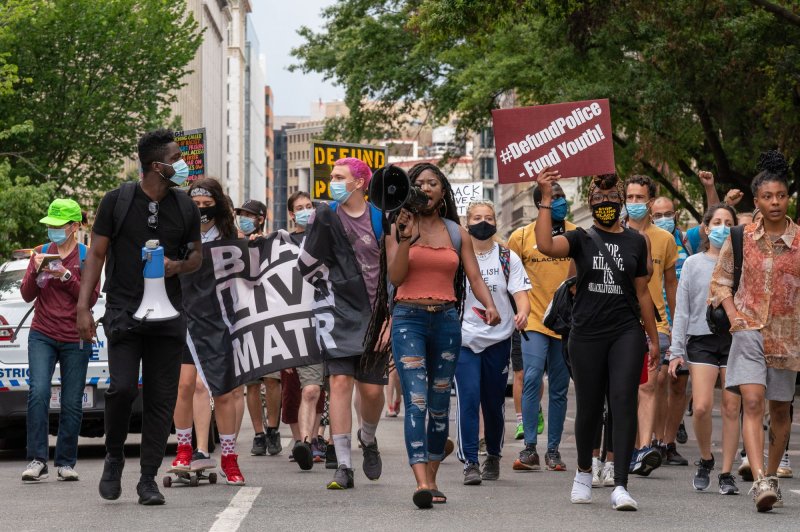 Activists march toward Black Lives Matter Plaza in Washington, D.C., on June 25, 2020, on the one-month anniversary of Floyd's death. File Photo by Ken Cedeno/UPI