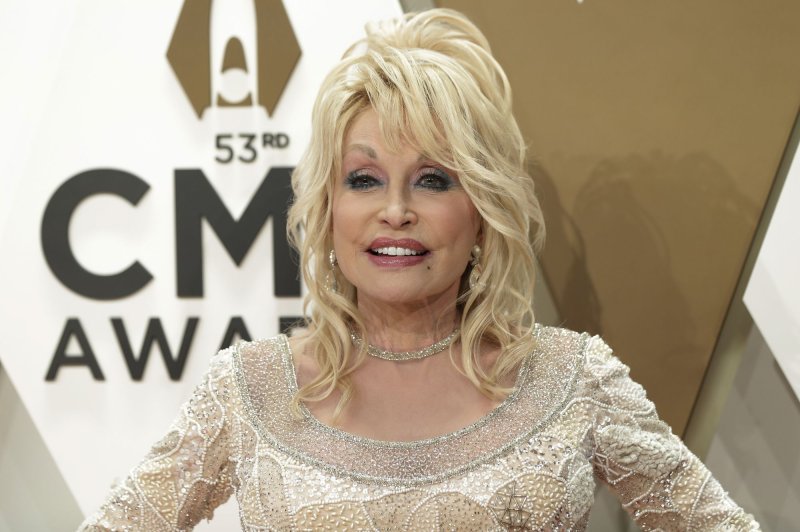 Dolly Parton (pictured) and Garth Brooks will host the Academy of Country Music Awards in Frisco, Texas, in May. File Photo by John Angelillo/UPI