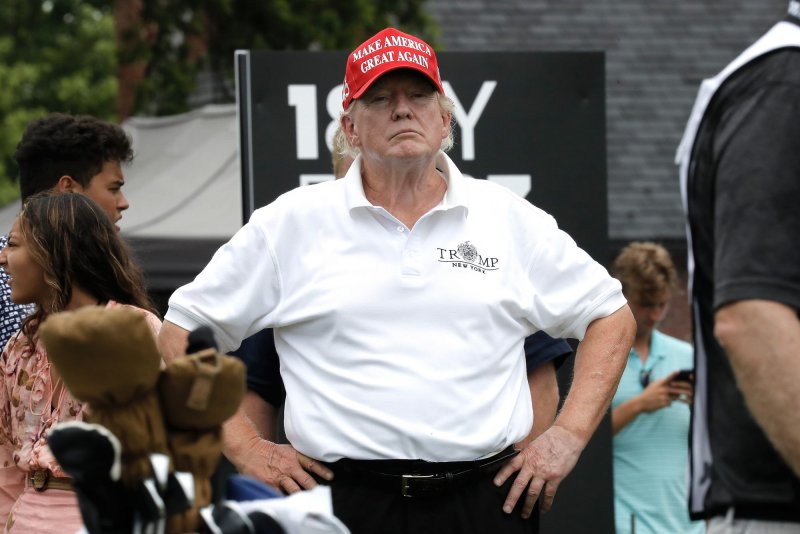 Former President Donald Trump watches play at the 16th hole tee at LIV Golf Bedminster invitational at the Trump National Golf Club in Bedminster, New Jersey, in July. File Photo by Peter Foley/UPI