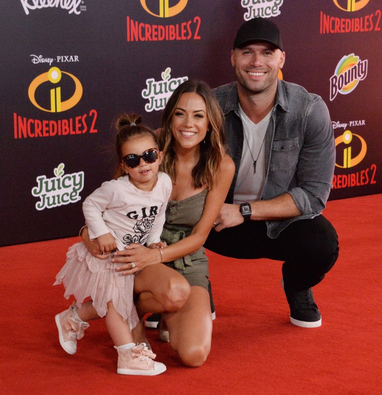 Jana Kramer (C), Mike Caussin (R) and daughter Jolie Rae attend the Los Angeles premiere of "Incredibles 2" on Tuesday. Photo by Jim Ruymen/UPI