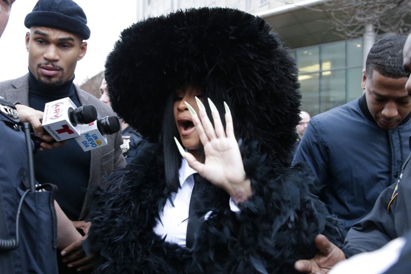 Cardi B exits Queens County Criminal Court in New York City in December 2019 after she was accused of throwing bottles and chairs at two bartenders at Angels Strip Club in Flushing in August 2018. File Photo by John Angelillo/UPI | <a href="/News_Photos/lp/1459c1e224c16055dba9c561611fbda0/" target="_blank">License Photo</a>
