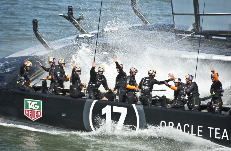 Oracle Team USA celebrates beating Emirates New Zealand in race 16 of the America's Cup Regatta on San Francisco Bay on September 23, 2013. The Americans' win leaves the Kiwis still at match point with the score now 8-6. UPI/Terry Schmitt | <a href="/News_Photos/lp/8a0f4660e077d1260211e2a94a17eaa1/" target="_blank">License Photo</a>