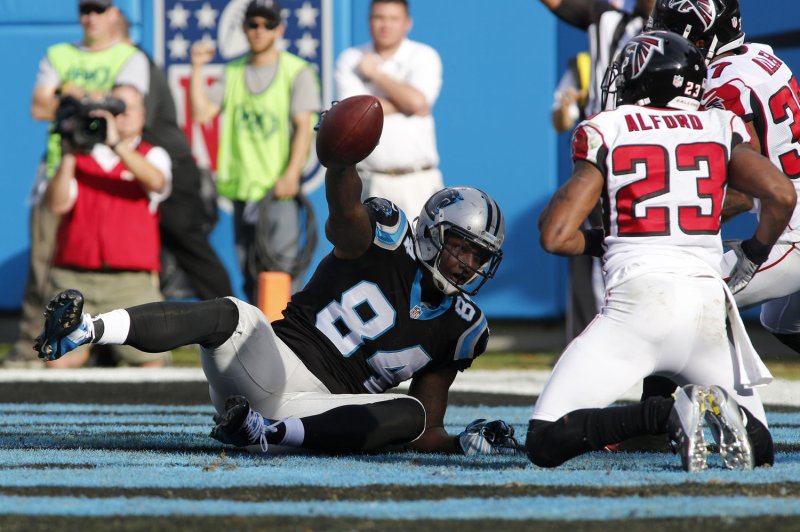 Carolina Panthers tight end Ed Dickson scores a touchdown on a four-yard pass from Cam Newton against the Atlanta Falcons in the first half of an NFL football game at Bank of America Stadium in Charlotte, North Carolina on December 13, 2015. UPI/Nell Redmond