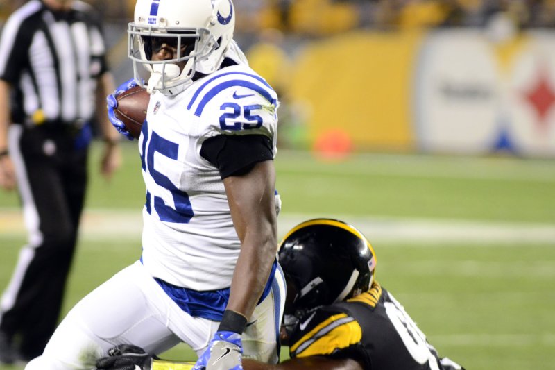 Indianapolis Colts running back Marlon Mack tries to break a tackle during a preseason game in 2017 against the Pittsburgh Steelers. Photo by Archie Carpenter/UPI