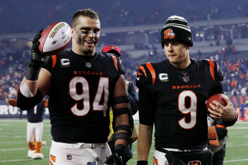 Cincinnati Bengals defensive end Sam Hubbard (94) celebrates with quarterback Joe Burrow after a playoff win over the Baltimore Ravens on Sunday at Paycor Stadium in Cincinnati. Photo by John Sommers II/UPI