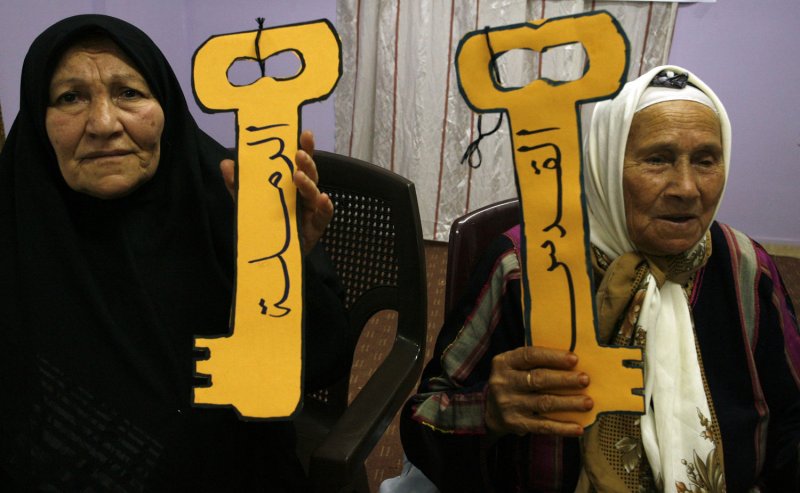 Palestinian refugees hold keys symbolizing the right of return for refugees, during a rally in Rafah refugee camp, southern Gaza Strip, ahead of Nakba on May 9, 2012. On May 15 Palestinians mark Nakba, or catastrophe of Israel's founding in the 1948 war, when hundreds of thousands of their brethren fled or were forced to leave their homes. UPI/Ismael Mohamad | <a href="/News_Photos/lp/95d9bf63e7485b8cd61e7d9a666f0cac/" target="_blank">License Photo</a>