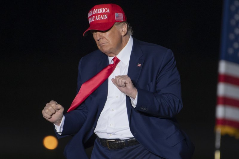 Former President Donald Trump does a little dance as he bids farewell to supporters at the "Save America" rally at Arnold Palmer Regional Airport in Latrobe, Penn., on Nov. 5. File Photo by Archie Carpenter/UPI
