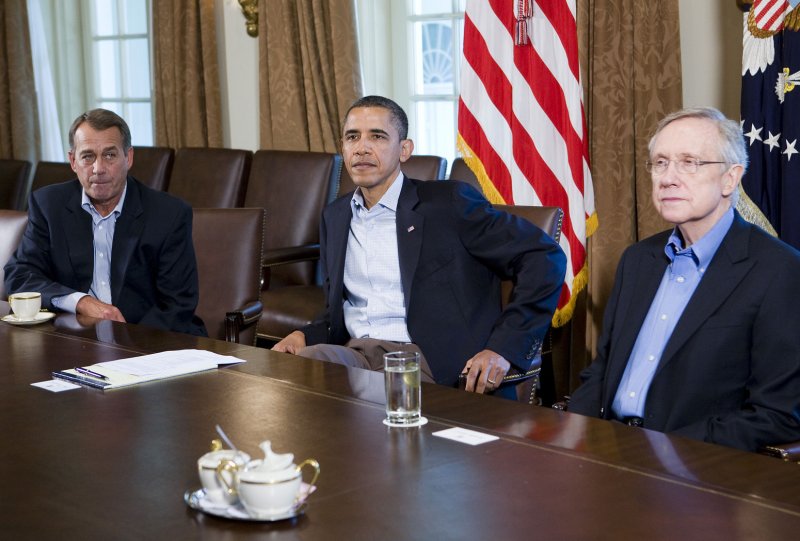 President Barack Obama meets with Speaker of the House John Boehner (L) and Senate Majority Leader Harry Reid (R), and other congressional leaders in the Cabinet Room of the White House on July 23, 2011 in Washington, DC.. The negotiations to raise the national debt ceiling collapsed yesterday after Speaker Boehner walked out of the talks. UPI/Kristoffer Tripplaar/Pool | <a href="/News_Photos/lp/c8c57917f17a6029afdef993d3b42d9e/" target="_blank">License Photo</a>