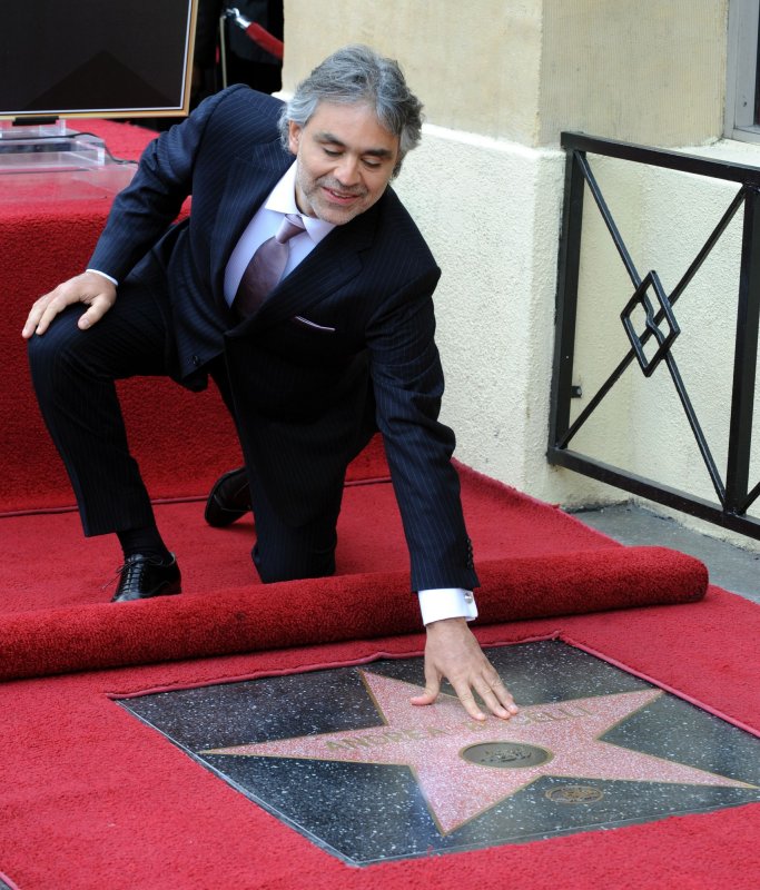 Italian tenor Andrea Bocelli touches his star during an unveiling ceremony honoring him with the 2,402nd star on the Hollywood Walk of Fame in Los Angeles on March 2, 2010. UPI/Jim Ruymen