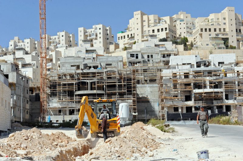 Builders at work in West Bank settlements