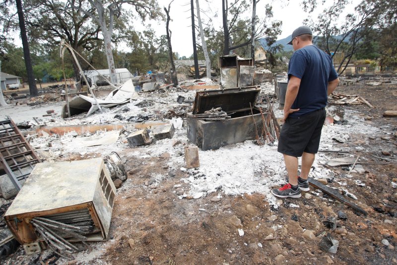 California wildfires destroy another 162 homes; suspicious death investigated