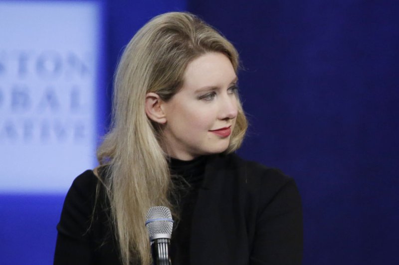 Theranos founder says she was abused by former COO and boyfriend