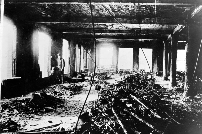 A police officer surveys the damage after the Triangle Shirtwaist Factory fire on March 25, 1911, in New York, New York. File Photo by a Brown Brothers/Cornell University