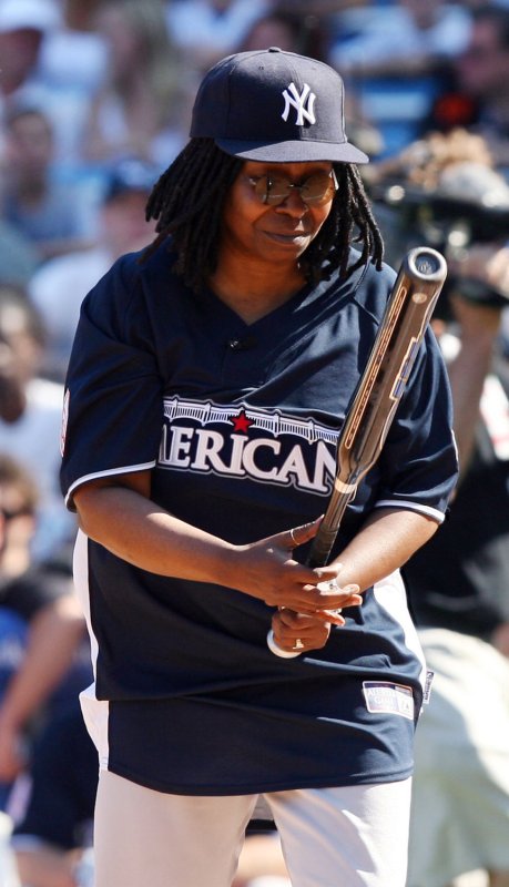 Whoopi Goldberg grabs a bat at the Taco Bell All-Star Legends & Celebrity Softball Game at Yankee Stadium in New York City on July 13, 2008. (UPI Photo/John Angelillo) | <a href="/News_Photos/lp/e825c57c7c130cd1fc01ddd49c7ac339/" target="_blank">License Photo</a>