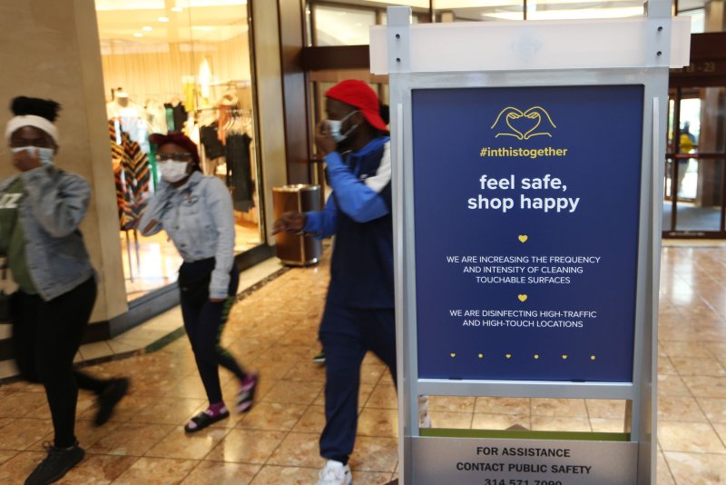 A sign at an indoor mall in Richmond Heights, Mo., encourages shoppers to take safety precautions against COVID-19. File Photo by Bill Greenblatt/UPI