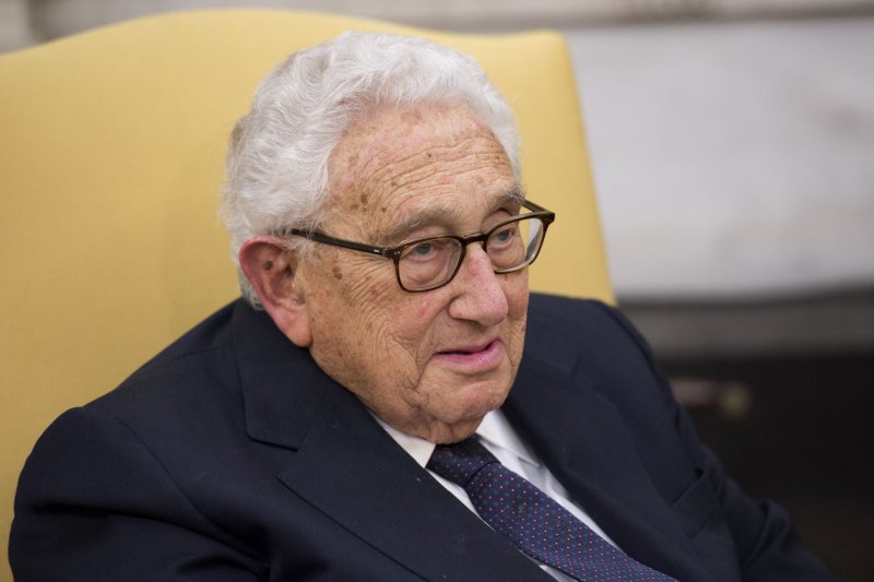 Former Secretary of State Henry Kissinger, who consulted presidents from both U.S. political parties throughout the decades, is pictured in the Oval Office at the White House in 2017. Kissinger died Wednesday at the age of 100. File Photo by Molly Riley/UPI