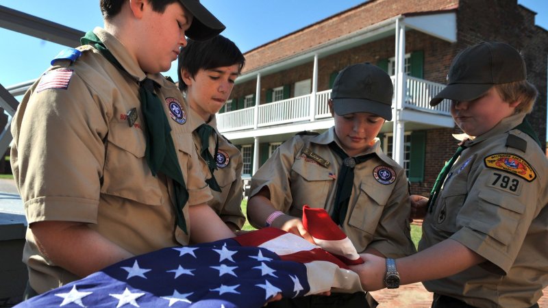 Scouts fold a flag during the Star-Spangled Camporee and celebration of the 100th Anniversary of the Boy Scouts of America at Fort McHenry in Baltimore on October 2, 2010. UPI/Kevin Dietsch